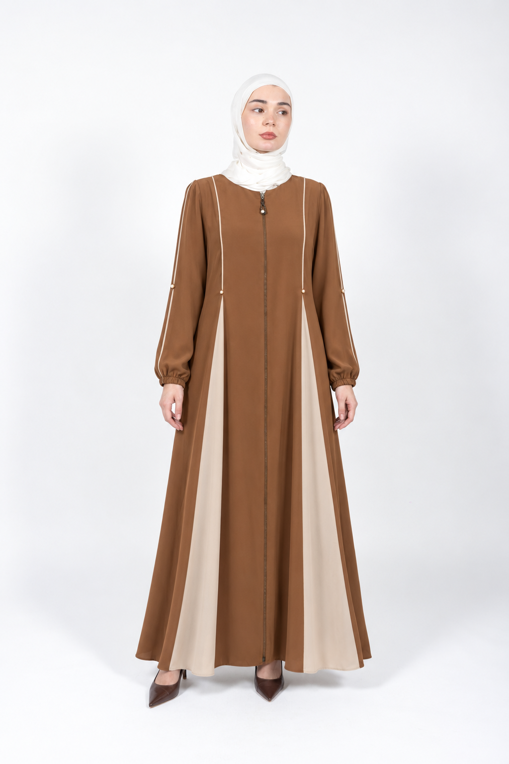Cumin viscose abaya with cream panels, piping and pearl details, full front view on model