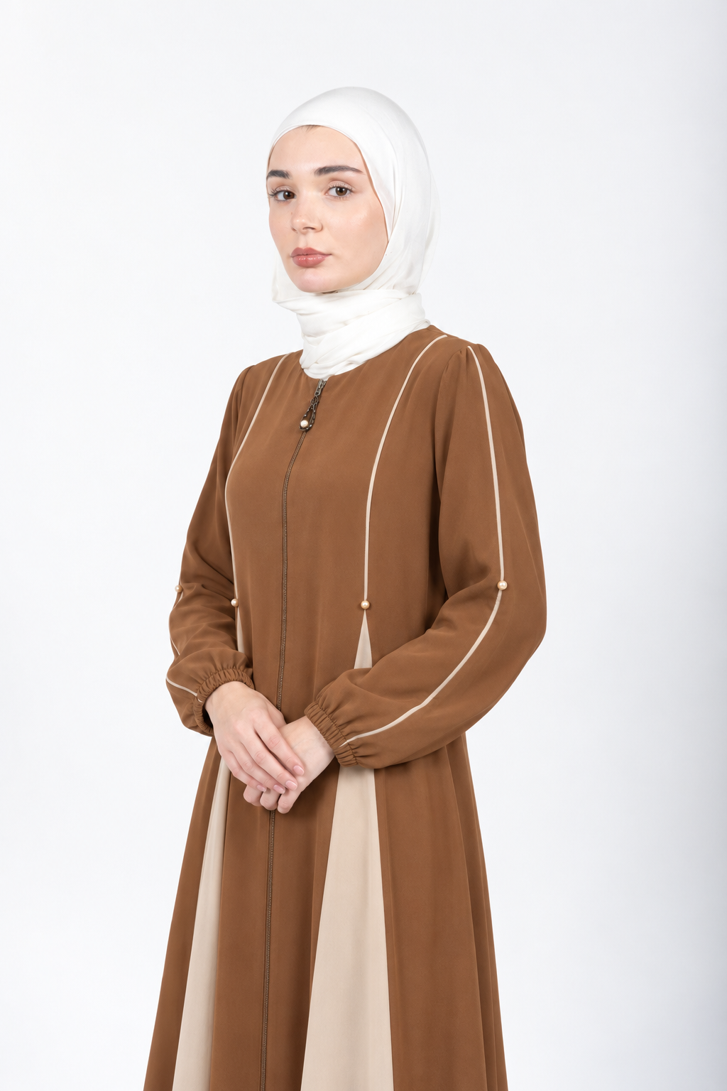 Cumin abaya with cream piping, portrait view