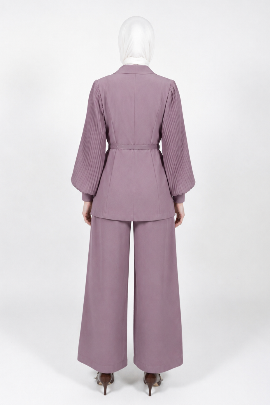 A mauve-colored two-piece suit with a pleated long-sleeve blazer and matching wide-leg trousers, shown from the back on a mannequin against a white studio background.