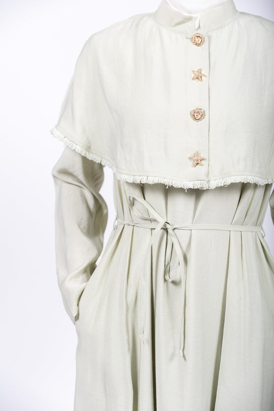Light green dress with a matching jacket on a white background