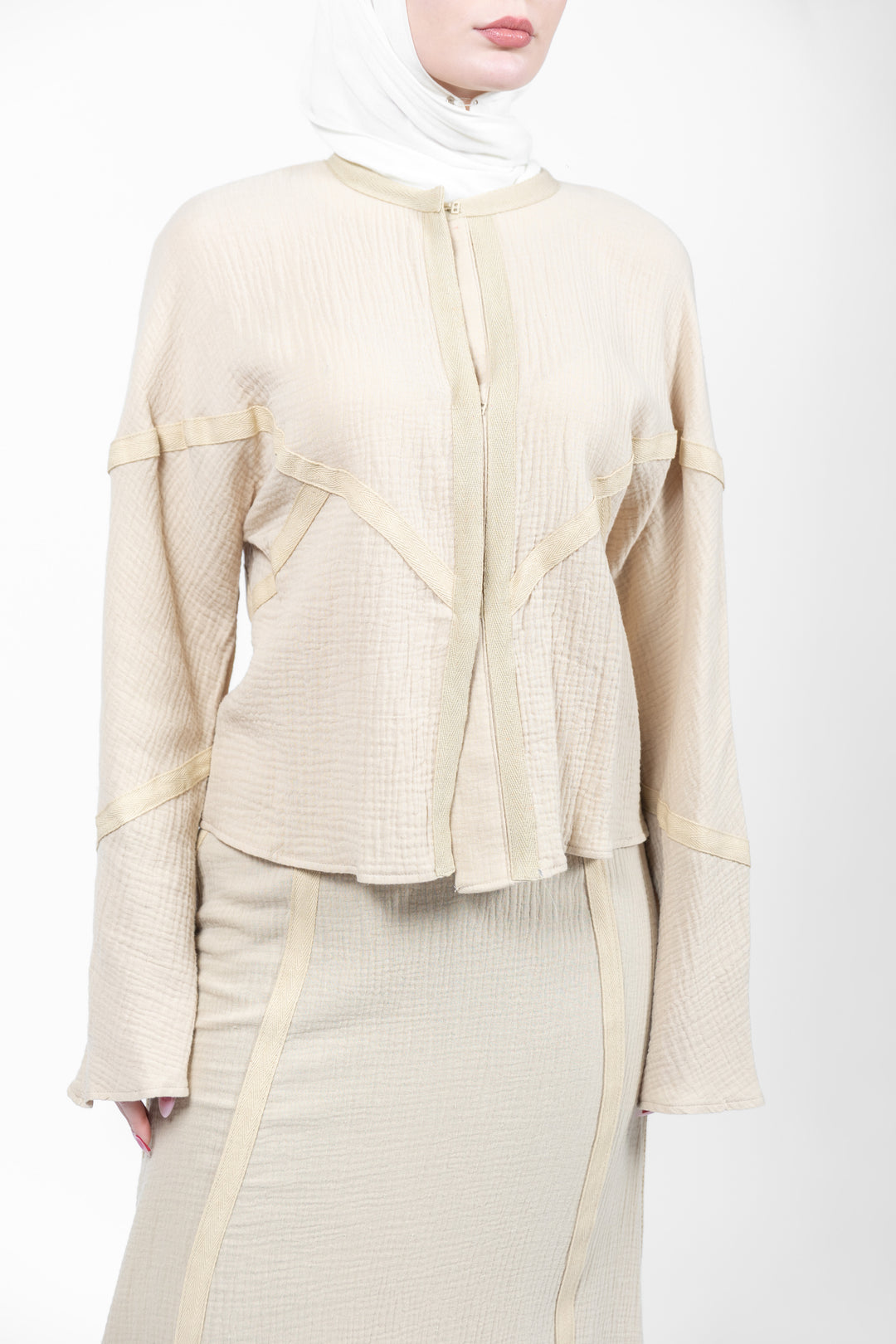 Beige outfit with a matching hijab on a white background