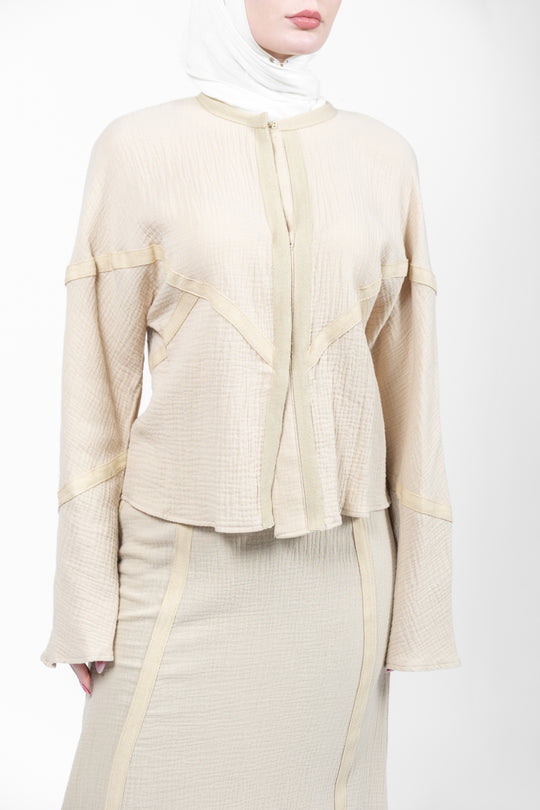 Beige outfit with a matching hijab on a white background